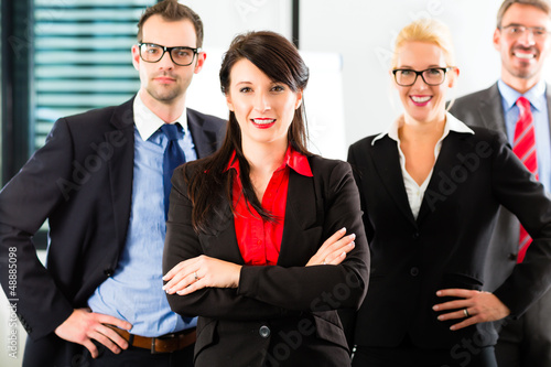 Photo: Business - group of businesspeople in office Business - group of businesspeople in office