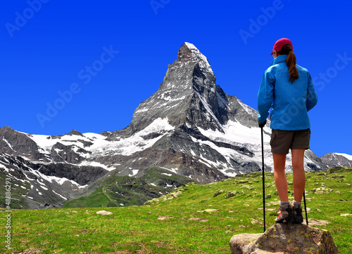 Photo: girl looking at the Mount Matterhorn in the Swiss Alps girl looking at the Mount Matterhorn in the Swiss Alps