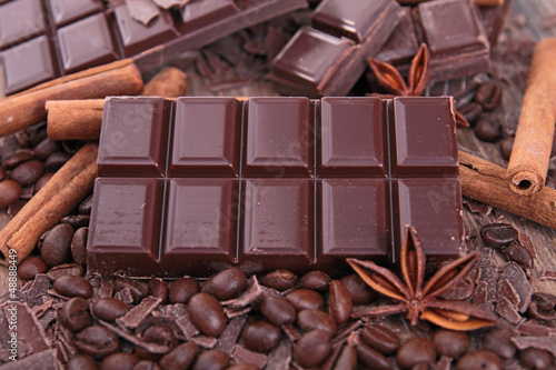 Photo: close up on chocolate bar and spices close up on chocolate bar and spices
