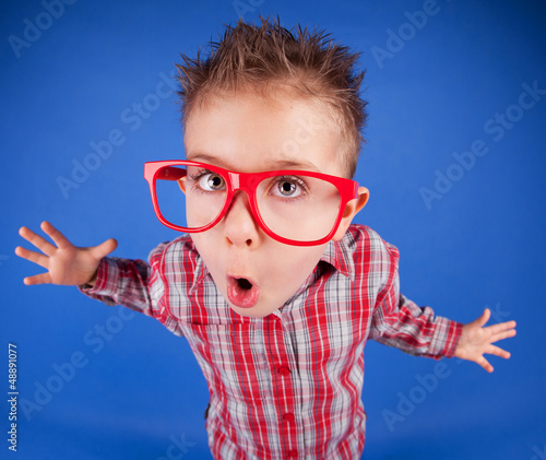 Photo: Funny five years old boy with expressive face, misbehave concept Funny five years old boy with expressive face, misbehave concept