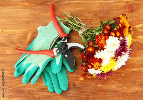 Photo: Secateurs with flower isolated on white Secateurs with flower isolated on white
