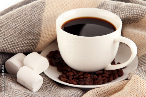 Photo: cup of coffee with scarf close-up cup of coffee with scarf close-up