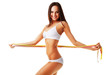 Foto: Smiling sporty brunette woman with three measures Smiling sporty brunette woman with three measures