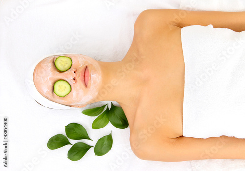 Photo: Young woman with creamy facial mask Young woman with creamy facial mask