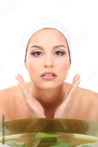 Photo: Young woman washing her face. Conceptual photo: make-up remover Young woman washing her face. Conceptual photo: make-up remover