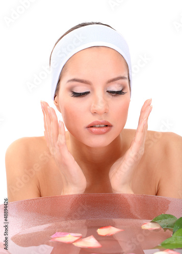 Photo: Young woman washing her face. Conceptual photo: make-up remover Young woman washing her face. Conceptual photo: make-up remover