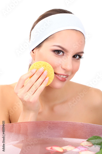 Photo: Young woman washing her face. Conceptual photo: make-up remover Young woman washing her face. Conceptual photo: make-up remover