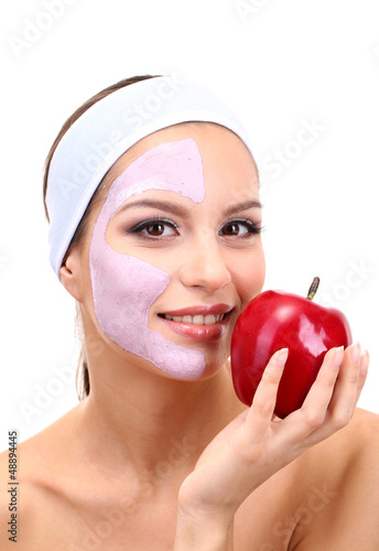 Photo: Young woman with clay facial mask, isolated on white Young woman with clay facial mask, isolated on white