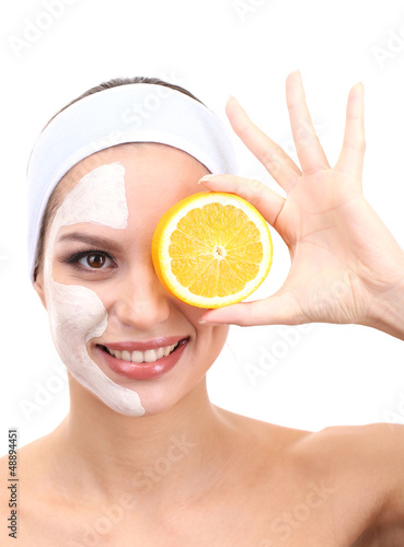 Photo: Young woman with clay facial mask, isolated on white Young woman with clay facial mask, isolated on white