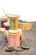 Foto: Buttons and sewing thread with needle Buttons and sewing thread with needle