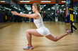 Young fit woman does suspension training