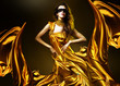 sensual adult woman in golden fabric and mask