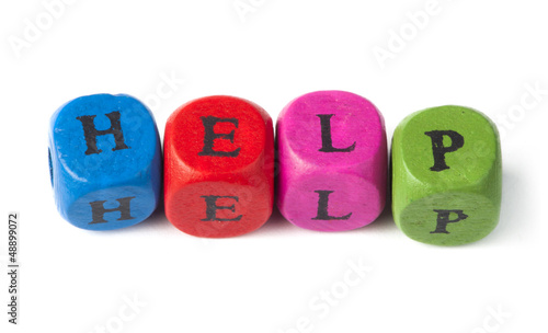 Photo: Word help on multicolored wooden cubes Word help on multicolored wooden cubes