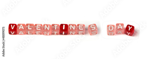 Photo: Words valentines day on multicolored cubes Words valentines day on multicolored cubes
