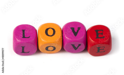 Photo: Word love on multicolored wooden cubes Word love on multicolored wooden cubes