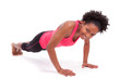 Young beautiful african fitness woman doing push up exercises on