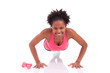 Young beautiful african fitness woman doing push up exercises on