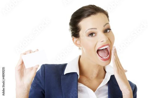 Photo: Businesswoman with businesscard. Businesswoman with businesscard.