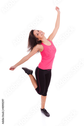 Photo: Young beautiful caucasian fitness woman dancing Young beautiful caucasian fitness woman dancing