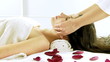 Beautiful woman getting head massage in spa