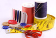 Some sewing tools such as threads, needles and scissors