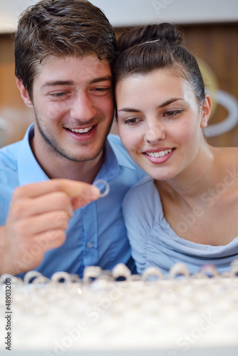 Photo: happy young couple in jewelry store happy young couple in jewelry store
