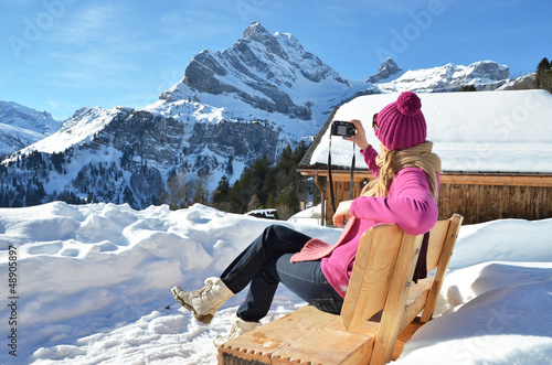 Photo: Girl with a camera in the Swiss Alps Girl with a camera in the Swiss Alps