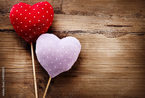 Photo: Valentines Vintage Handmade Hearts over Wooden Background Valentines Vintage Handmade Hearts over Wooden Background