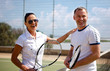 Couple handshaking at the tennis court after a match 