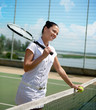 Young woman on a tennis court 