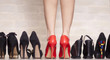 Female legs in red shoes