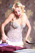 Housewife irons clothes and makeup corrects 