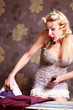 Housewife irons clothes and makeup corrects 