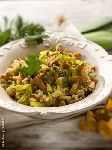Photo: risotto with mushrooms and leek, selective focus risotto with mushrooms and leek, selective focus