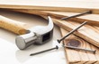 Wood planks with hammer and nails on white background