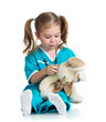 Adorable child with clothes of doctor examining hare toy over wh