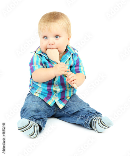 Photo: Little boy with wooden spoon, isolated on white Little boy with wooden spoon, isolated on white