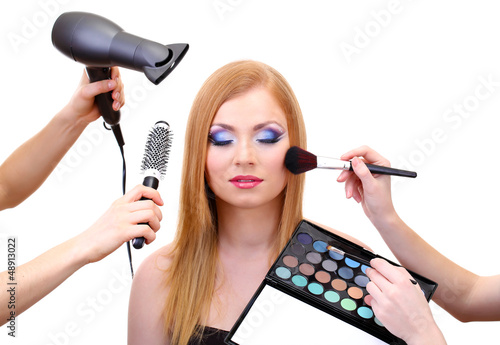 Photo: Beautiful young woman and hands with eyes shadows, brush and Beautiful young woman and hands with eyes shadows, brush and