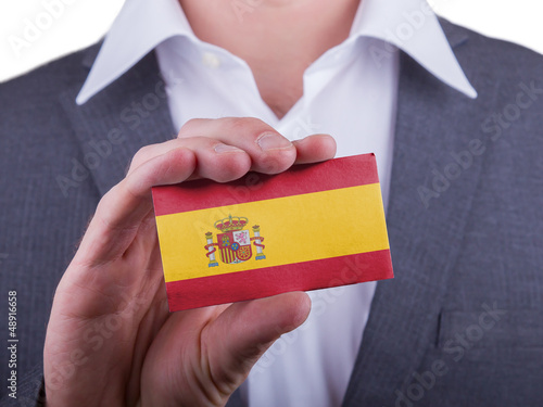Photo: Businessman showing card, matte paper effect Businessman showing card, matte paper effect