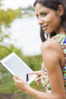 Mixed Race Latina Woman Using Tablet Computer