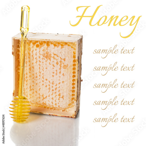 Photo: Honey in a wooden frame with a spoon Honey in a wooden frame with a spoon