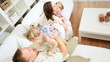 Happy Young Family Playing Together Home Couch