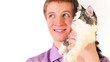 Young boy hold cat on hand, they move eyes follow something