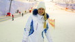 blonde nice girl gestures shows her delight in indoor ski