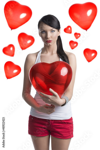 Photo: sexy brunette with heart shaped balloon in front of the camera sexy brunette with heart shaped balloon in front of the camera