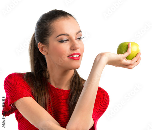 Photo: Young beautiful woman holding an apple Young beautiful woman holding an apple