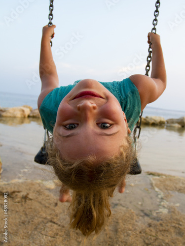 Photo: Summer joy - lovely girl playing on the beach Summer joy - lovely girl playing on the beach
