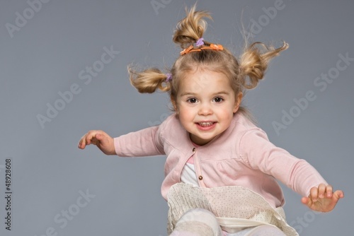 Photo: Little girl having fun Little girl having fun