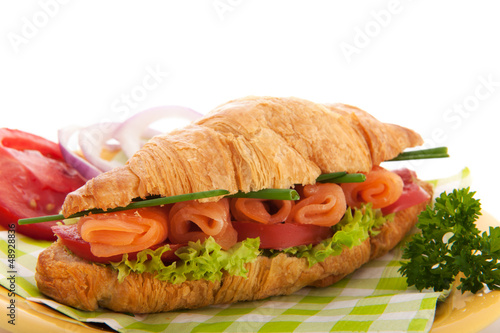 Photo: Croissant with salmon and vegetables Croissant with salmon and vegetables