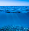 still calm sea water surface with clear sky  and underwater worl